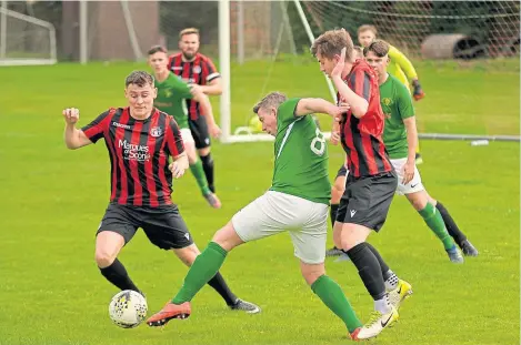  ??  ?? Scone Thistle (red/black) beat Lochee Harp 3-0 in the Macron Scottish Cup at Farquharso­n Park last week.