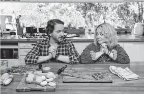  ?? Vince Valitutti/Netflix ?? Real-life spouses Ben Falcone as Clark Thompson and Melissa McCarthy as Amily Luck star in the new Netflix comedy “God’s Favorite Idiot.”