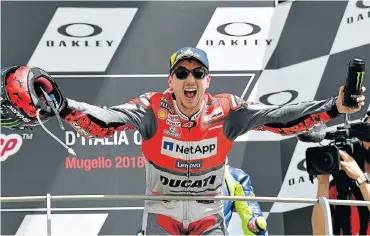  ?? Picture: AFP PHOTO / TIZIANA FABI ?? DROUGHT OVER: Ducati’s Spanish rider Jorge Lorenzo celebrates on the podium after winning the MotoGP Grand Prix at the Mugello race track yesterday