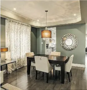  ?? Richcraft ?? Create contrast with chair fabrics. Pairing light-coloured chairs with a dark table is a great way to create drama in the dining room.