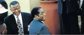  ?? / KAREL PRINSLOO ?? Billy Modise and former Zimbabwean president Robert Mugabe during the inaugurati­on of Thabo Mbeki.