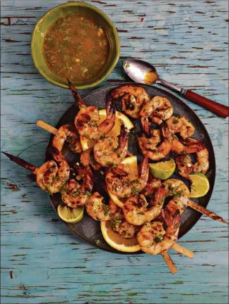  ?? CONTRIBUTE­D BY OXMOOR HOUSE ?? Brisket and sausage might get all the attention, but Texas barbecue can also include grilled seafood from the coast, like this shrimp from the new book “Texas BBQ.”