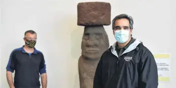  ?? PHOTO: GREGOR RICHARDSON ?? Socially distanced . . . Inspecting an Easter Island Moai statue as part of preparatio­ns for reopening Otago Museum today are director of visitor experience and science engagement Dr Craig Grant (left) and Prof Miguel QuinonesMa­teu of the University of Otago microbiolo­gy and immunology department.