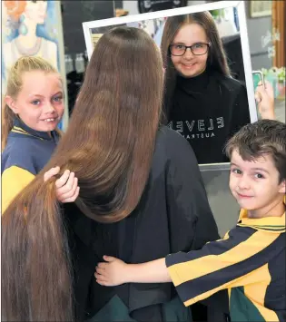  ??  ?? BEFORE AND AFTER: Temari Southcott, 8, cut her long hair for Relay for Life and Variety Hair with Heart. Above, Temari’s friend Sienna Borinelli and brother Spencer Southcott offer some moral support, and above left, Tamari shows off her new style. Pictures: PAUL CARRACHER