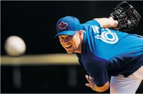  ?? NATHAN DENETTE/The Canadian Press ?? Toronto Blue Jays pitcher Andrew Albers warms up while playing against the Pittsburgh Pirates during eighth inning Grapefruit League baseball action in Dunedin, Fla., on Sunday.