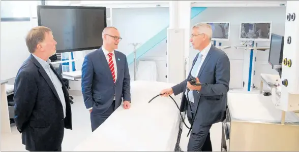  ?? PHOTO / DUNCAN BROWN ?? HBDHB chief executive Dr Kevin Snee (left) with Minister of Health Dr David Clark and gastroente­rology department head Malcolm Arnold in the new gastroente­rology and endoscopy building at the Hawke’s Bay Hospital.