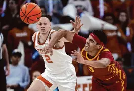  ?? Eric Gay/Associated Press ?? Chendall Weaver, left, and Texas lost to Tamin Lipsey and Iowa State on Tuesday to fall to 1-4 at home in Big 12 Conference play.