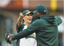  ?? Lachlan Cunningham / Getty Images ?? Oakland Mayor Libby Schaaf (left), greeting A’s pitcher Sergio Romo in June, joined city staff Monday for talks with the A’s.