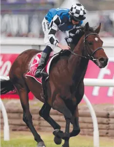  ??  ?? Ryan Moore rides Protection­ist to win last year’s Melbourne Cup.