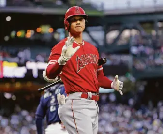  ?? Ken Lambert / TNS 2021 ?? Shohei Ohtani inspired baseball brass to declare that the starting pitcher who doubles as the designated hitter can remain in the game as the DH after his pitching stint is over.