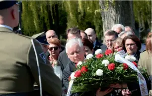  ?? AFP ?? The ruling party Law and Justice leader and twin brother of the former Polish President Lech Kaczynski, Jaroslaw Kaczynski, lays a wreath during a ceremony at the Powazki cemetery to mark the seventh anniversar­y of the crash of the Polish government...