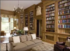  ??  ?? Grand: The wood-panelled library is a haven of tranquilli­ty