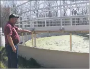  ??  ?? Town of La Plata Director of Operations Robert Stahl demonstrat­es how sewer and wastewater is cleaned at the Public Works site on April 5.