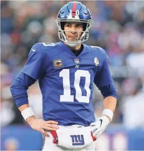  ?? BRAD PENNER/USA TODAY SPORTS ?? Giants 38-year-old quarterbac­k Eli Manning says he expects the team to draft a passer, but which round might it be in?