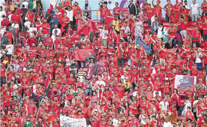  ?? — AFP ?? Fans of Morocco remain on the stands at the end of the Qatar 2022 World Cup Group F match between Morocco and Croatia at the Al Bayt Stadium in Al Khor, north of Doha.