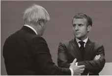  ?? AFP ?? Britain’s Prime Minister Boris Johnson and French President Emmanuel Macron at the Cop26 summit this month