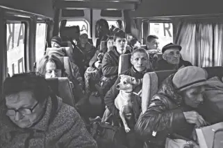  ?? AP Photo/evgeniy Maloletka ?? People sit in a bus during evacuation from lyman, Donetsk region, eastern Ukraine on Saturday, April 30, 2022.