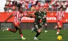  ?? Carlos Barba/EPA ?? Girona’s Yan Couto resists the challenge of Almeria’s Sergio Akieme. Photograph: