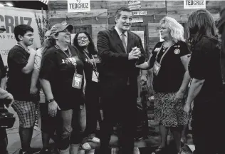  ?? Photos by Lisa Krantz / San Antonio Express-News ?? U.S. Sen. Ted Cruz talks with supporters during the Texas Republican gathering at the Convention Center. He said the election is all about turnout.