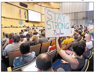  ?? AP/ELAINE THOMPSON ?? People pack the room Monday for the Seattle City Council’s vote on a per-employee tax on large businesses to help the city’s homeless.