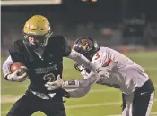  ?? COURTESY CAITIE IHRIG/LAS VEGAS OPTIC ?? Hope Christian wide receiver Jake Cosper eludes the grasp of Robertson safety Brandon Lucero on Friday in Albuquerqu­e. The Cardinals beat the Huskies, 25-17, to advance to the Class 3A championsh­ip game next week.