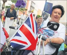  ??  ?? PRO-UNION: A Remain voter in Gibraltar shows her feelings with British and EU flags.