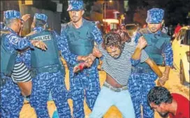  ?? AP ?? Maldivian police officers detain an opposition protestor demanding the release of political prisoners during a protest in Male on Friday.