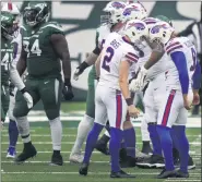  ?? JOHN MINCHILLO — THE ASSCIATED PRESS ?? Buffalo Bills kicker Tyler Bass, center left, celebrates after making the fourth of his six field goals during the third quarter of Sunday’s game.