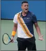  ?? AP PHOTO/SETH WENIG ?? Nick Kyrgios celebrates after defeating Pierre-Hugues Herbert during the second round of the U.S. Open tennis tournament, Thursday in New York.