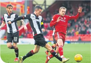  ??  ?? St Mirren’s Paul McGinn in action with Aberdeen’s James Wilson