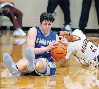  ?? [KYLE ROBERTSON/DISPATCH] ?? Nick Nakasian of Olentangy Liberty comes up with a steal against Westervill­e North’s Julius Brown during the second half.