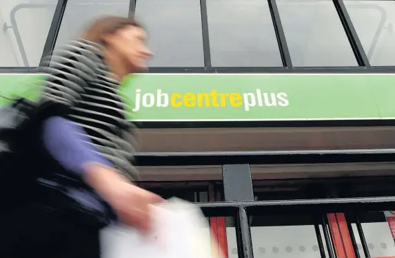  ?? Martin Rickett ?? > The number of people in work in Wales has fallen – but in the UK as a whole, unemployme­nt is at its lowest level since 1975