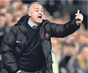  ??  ?? United manager Ray McKinnon does some reorganisi­ng after referee Don Robertson sent off Lewis Toshney.