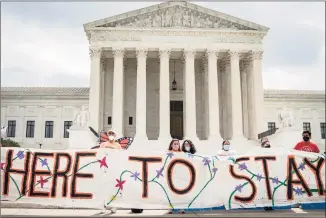  ?? Drew Angerer / TNS ?? DACA recipients and their supporters rally outside the U.S. Supreme Court in Washington, D.C., on June 18, 2020.