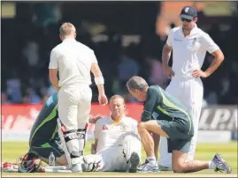  ??  ?? Australia opener Chris Rogers, who felt giddy and had to be helped off the pitch, was the only spot of bother as the visitors swept aside England in the second Ashes Test on Sunday. REUTERS PHOTO