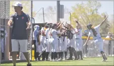  ?? ?? The Lady Tigers celebrate a Kendra Sandoval home run.