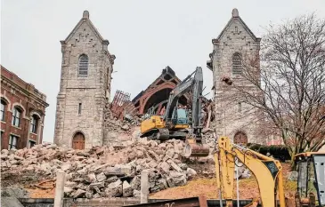  ?? Hearst Connecticu­t Media ?? Demolition after the collapse of the Engaging Heaven Church’s steeple.