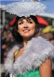  ?? Photos: Gerry Mooney/PA ?? Above: Jennifer Rynne, from Mohill, Co Leitrim, in the betting ring. Above right: Michael O’Leary kisses wife Anita Farrell after their horse Balko Des Fos won the Ryanair Steeple Chase. Right: Carol O’Connell grimaces as she follows the progress of Un...