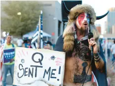  ?? DARIO LOPEZ-MILLS/AP ?? Jacob Chansley, a QAnon believer, speaks to a crowd of Trump supporters in Phoenix on Nov. 5, 2020.