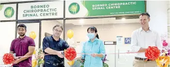  ??  ?? Dr Sharukh (left), Dr Naismith (second left) and Dr Davis (right), accompanie­d by the centre’s receptioni­st Christy Sze (second right), cutting the ribbon to mark the grand opening of Borneo Chiropract­ic Spinal Centre at Likas Square.