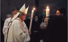  ?? Remo Casilli / Associated Press ?? Pope Francis celebrates the Easter Vigil in a nearly empty St. Peter's Basilica as coronaviru­s pandemic restrictio­ns stay in place for a second year running, at the Vatican, Saturday.