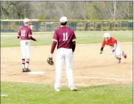  ?? MARK HUMPHREY ENTERPRISE-LEADER ?? Farmington junior Evan Shoffit dives headfirst into third base while Panther infielders await a throw during the Cardinals’ 8-0 home victory over Siloam Springs on Monday, April 1.