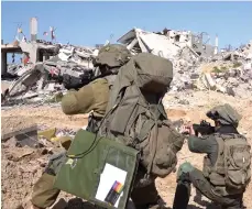  ?? Reuters ?? Israeli soldiers operate amid the ruins of buildings as part of their incursion in Gaza