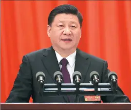  ?? YAO DAWEI AND LIU WEIBING / XINHUA ?? President Xi Jinping speaks at the closing meeting of the first session of the 13th National People’s Congress at the Great Hall of the People in Beijing on Tuesday. NPC deputies stand as they sing the national anthem at the closing meeting.