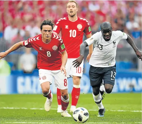  ?? Picture: ETSUO HARA/GETTY IMAGES ?? NO WAY THROUGH: Mathias Jorgensen, right, of France and Thomas Lemar, of Denmark, compete for the ball during their Group C match in Moscow which ended in a goalless draw yesterday