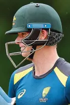  ??  ?? Extra cover: Smith wears stem guards in the nets yesterday