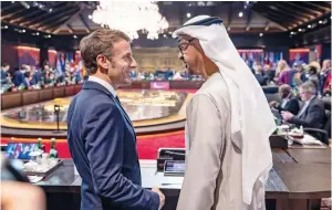  ?? See Page 14 ?? Sheikh Mohamed bin Zayed Al Nahyan speaks with French President Emmanuel Macron during the first session of the G20 summit at the Apurva Kempinski hotel in Bali, Indonesia, on Tuesday.