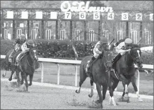  ?? The Sentinel-Record/Richard Rasmussen ?? FANTASY LAND: Jockey Richard Eramia and Cosmic Burst (3) pass Amy’s Challenge (6), right, and jockey Jareth Loveberry on March 10 to win the the Grade 3 $200,000 Honeybee Stakes for 3-yearold fillies at Oaklawn Park. Trainer Donnie K. Von Hemel said...