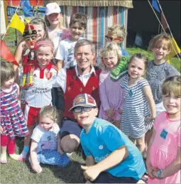  ?? FM4475513 ?? Robert Styles entertains children at the Punch and Judy tent, as a part of a seaside-themed event at Kent Life