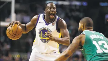  ?? MICHAEL DWYER — ASSOCIATED PRESS ?? Just hours after his appearance at the Harvard Kennedy School, Warriors forward Draymond Green drives against the Boston Celtics’ Marcus Morris on Thursday night. The Warriors lost, 92-88.